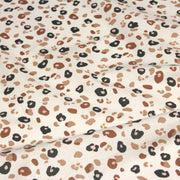 Tissu cotonnade LEOPARD, écru et taches léopard noires, roses, ocres - OEKO - TEX STANDARD 100 - TissusPapi.com