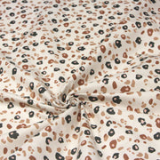 Tissu cotonnade LEOPARD, écru et taches léopard noires, roses, ocres - OEKO - TEX STANDARD 100 - TissusPapi.com