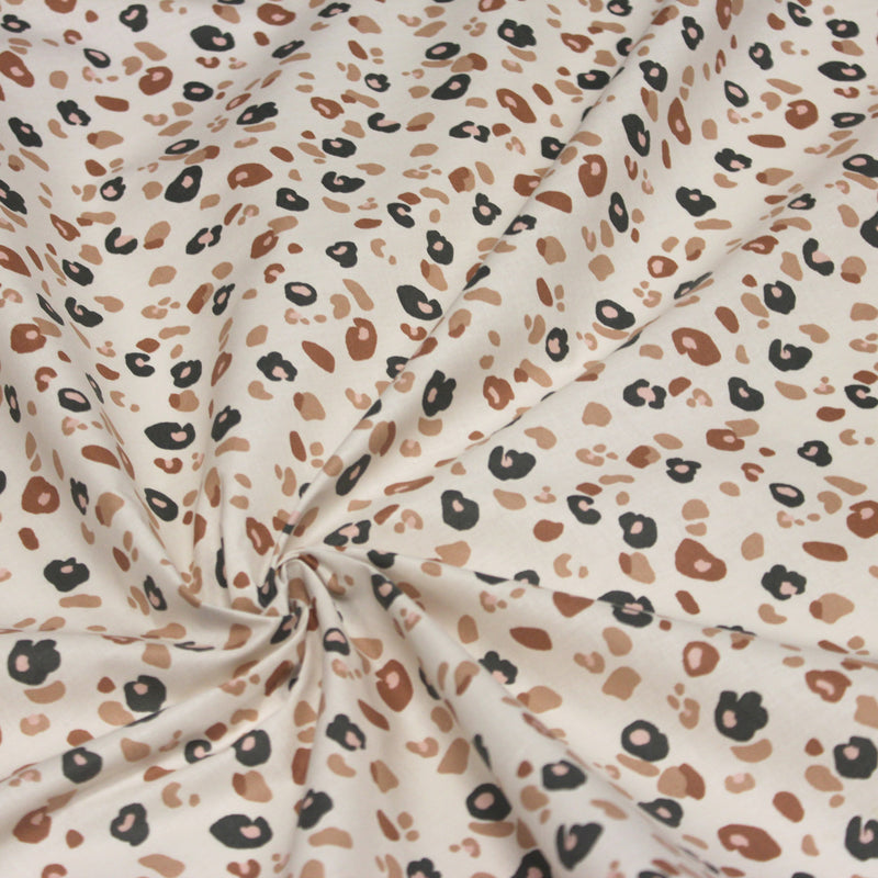 Tissu cotonnade LEOPARD, écru et taches léopard noires, roses, ocres - OEKO - TEX STANDARD 100 - TissusPapi.com