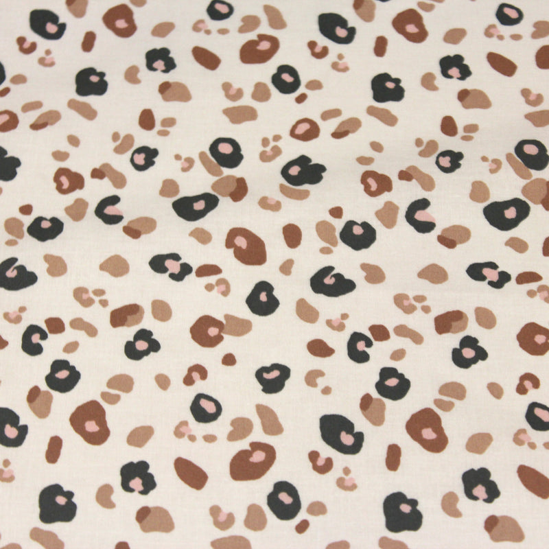Tissu cotonnade LEOPARD, écru et taches léopard noires, roses, ocres - OEKO - TEX STANDARD 100 - TissusPapi.com