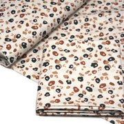 Tissu cotonnade LEOPARD, écru et taches léopard noires, roses, ocres - OEKO - TEX STANDARD 100 - TissusPapi.com