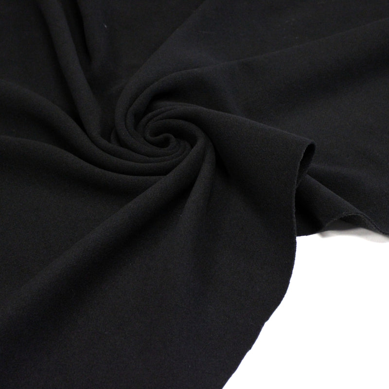 Tissu lainage épais et souple, noir uni, fabrication italienne