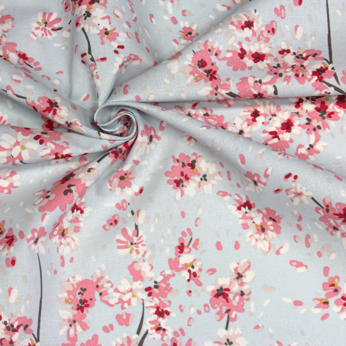 Tissu de coton bleu ciel aux fines fleurs de cerisiers japonais roses - COLLECTION CHERRY BLOSSOM GIRL - OEKO-TEX