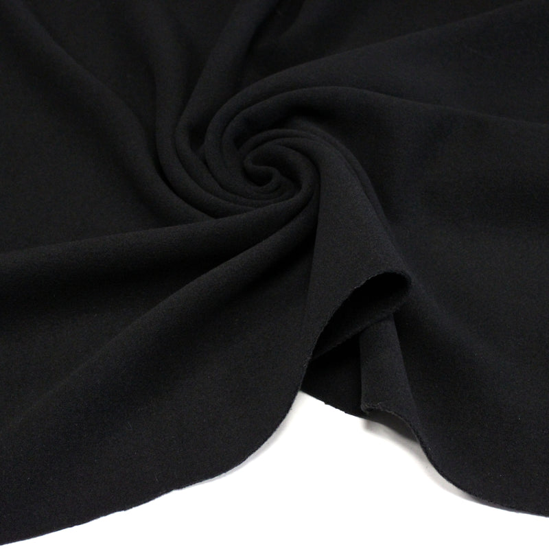 Tissu lainage épais et souple, noir uni, fabrication italienne