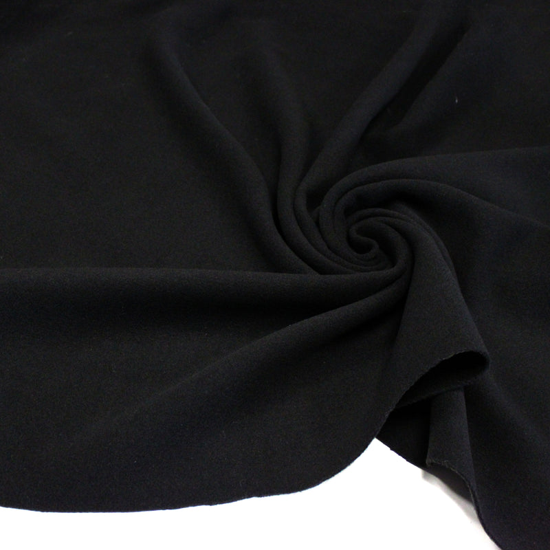 Tissu lainage épais et souple, noir uni, fabrication italienne