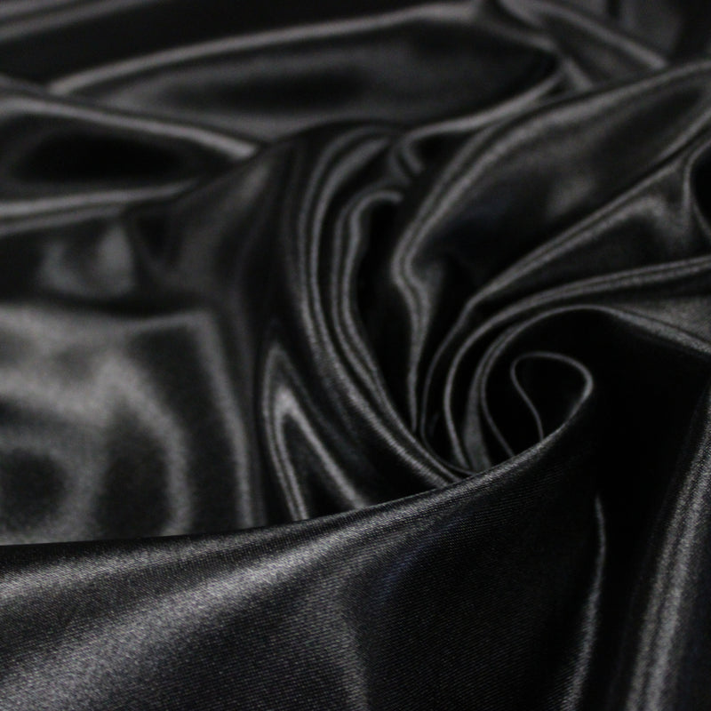 Tissu satin polyester noir uni, fabrication italienne