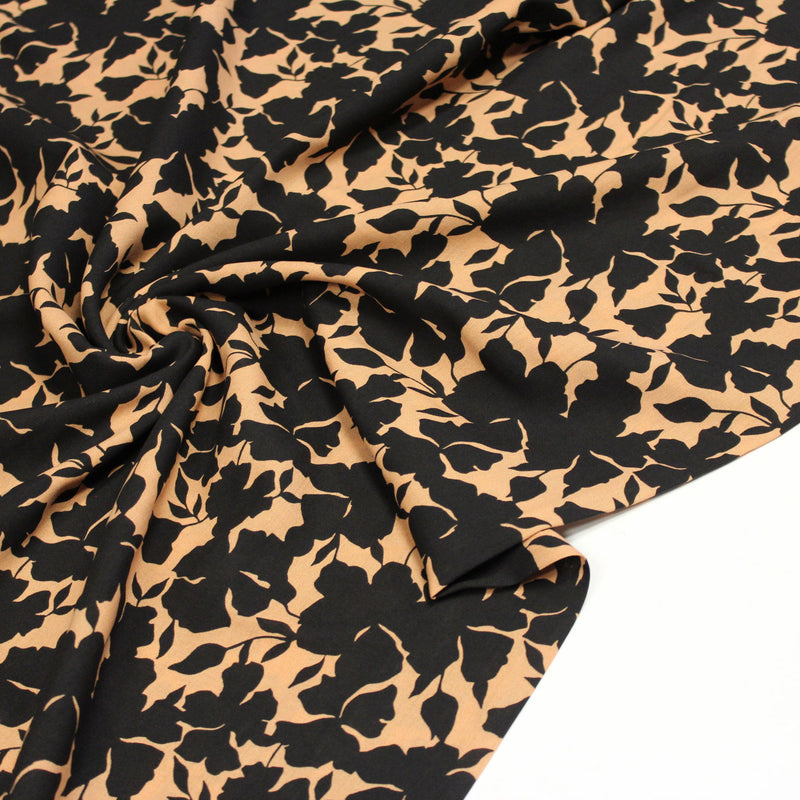 Tissu viscose fluide ocre aux feuilles noires façon silhouette - OEKO-TEX STANDARD 100 - TissusPapi.com