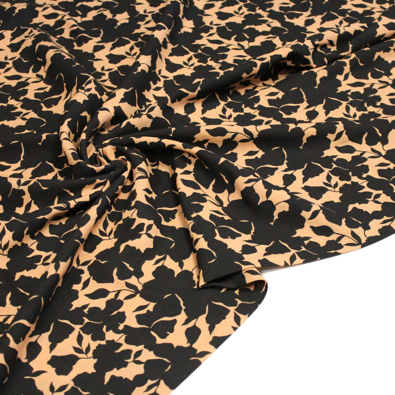 Tissu viscose fluide ocre aux feuilles noires façon silhouette - OEKO-TEX STANDARD 100 - TissusPapi.com
