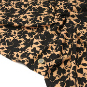 Tissu viscose fluide ocre aux feuilles noires façon silhouette - OEKO-TEX STANDARD 100 - TissusPapi.com