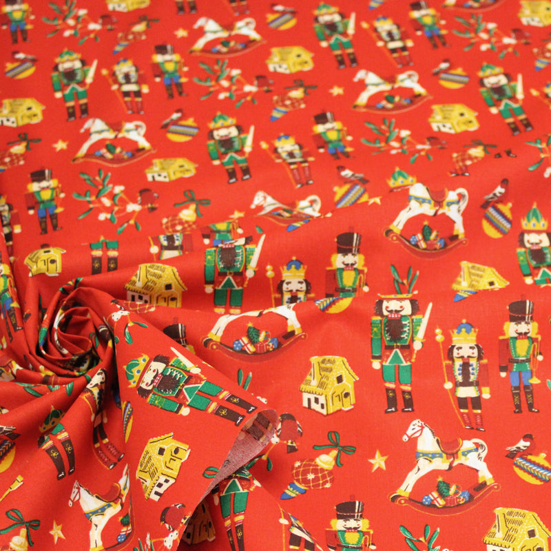 Tissu cotonnade de NOËL – Casse-noisettes et jouets d’antan, fond rouge - OEKO-TEX STANDARD 100