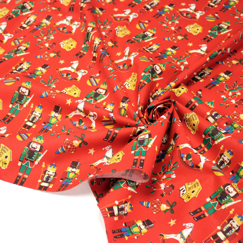 Tissu cotonnade de NOËL – Casse-noisettes et jouets d’antan, fond rouge - OEKO-TEX STANDARD 100