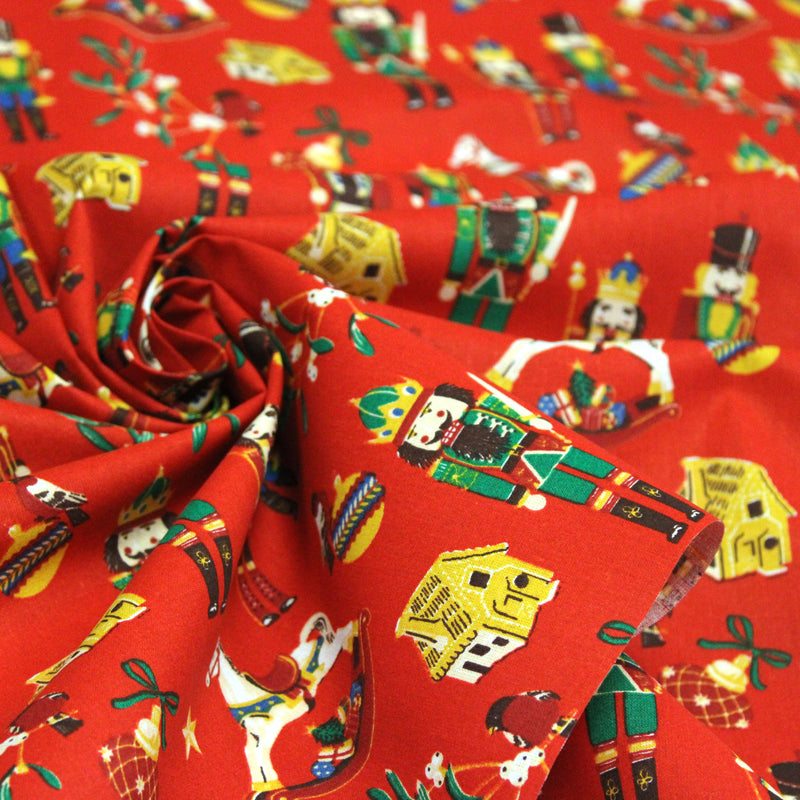 Tissu cotonnade de NOËL – Casse-noisettes et jouets d’antan, fond rouge - OEKO-TEX STANDARD 100
