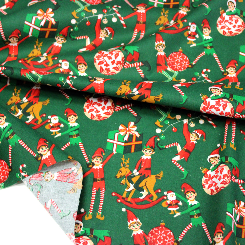 Tissu cotonnade de NOËL, les lutins et objets de Noël, fond vert - OEKO-TEX STANDARD 100