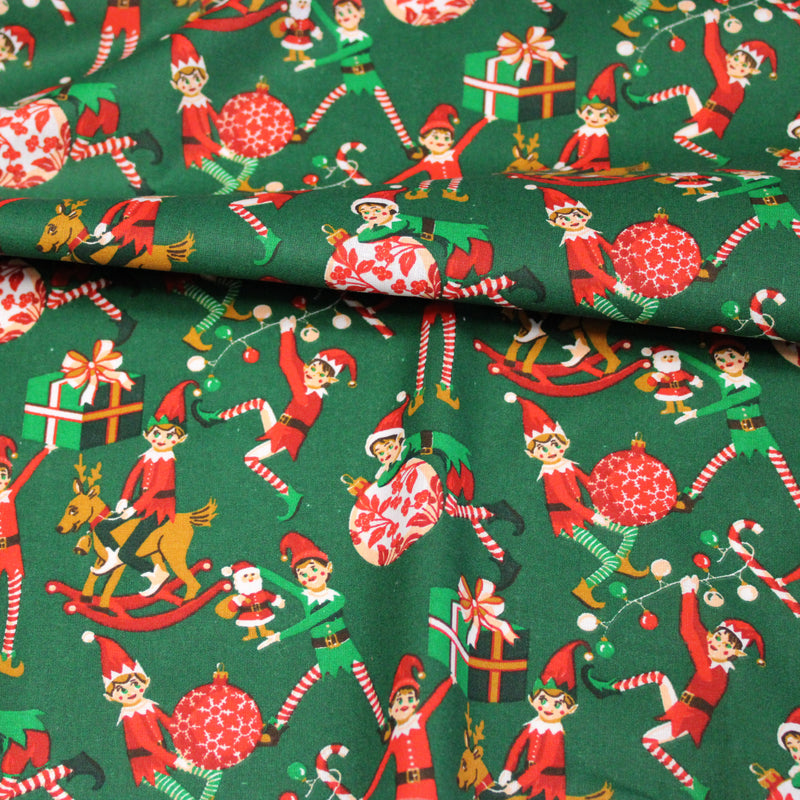 Tissu cotonnade de NOËL, les lutins et objets de Noël, fond vert - OEKO-TEX STANDARD 100