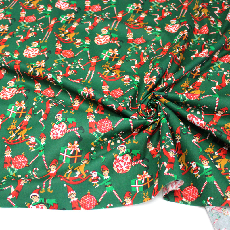 Tissu cotonnade de NOËL, les lutins et objets de Noël, fond vert - OEKO-TEX STANDARD 100