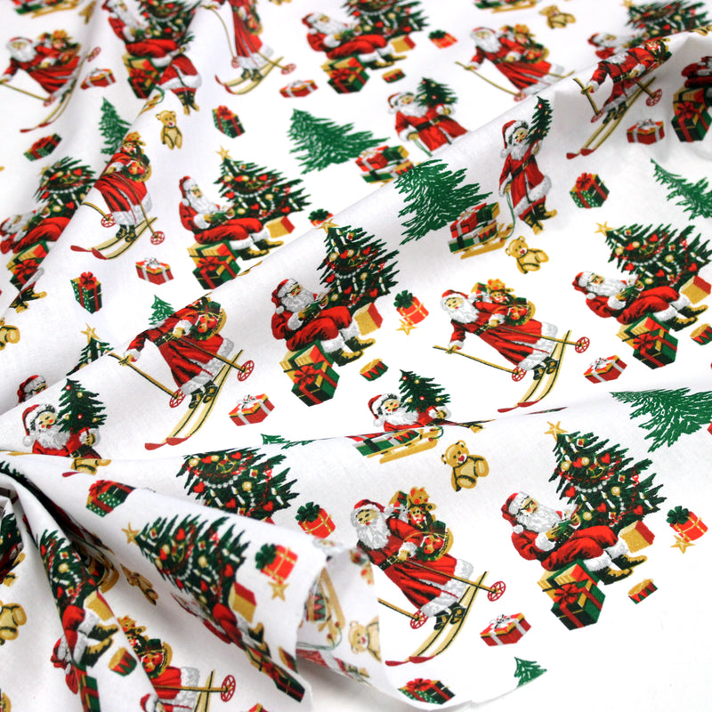 Tissu cotonnade de NOËL, le père Noël à ski, fond blanc - OEKO-TEX STANDARD 100