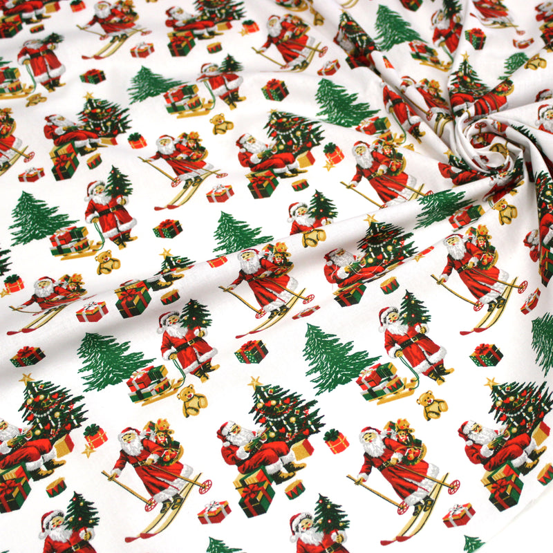 Tissu cotonnade de NOËL, le père Noël à ski, fond blanc - OEKO-TEX STANDARD 100