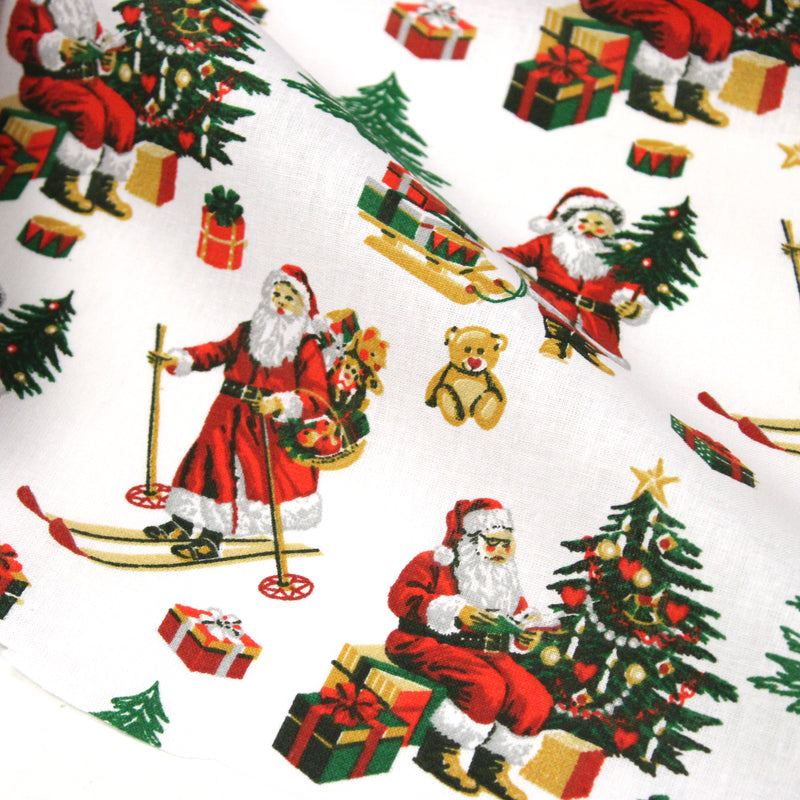 Tissu cotonnade de NOËL, le père Noël à ski, fond blanc - OEKO-TEX STANDARD 100
