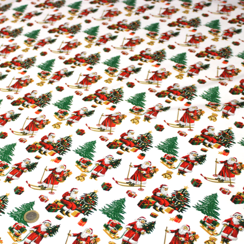 Tissu cotonnade de NOËL, le père Noël à ski, fond blanc - OEKO-TEX STANDARD 100