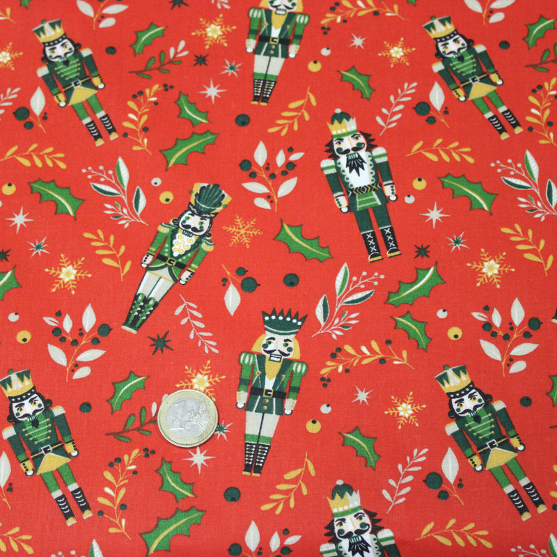Tissu cotonnade de NOËL, Casse-noisettes, houx et feuillages ocres, fond rouge - OEKO-TEX STANDARD 100