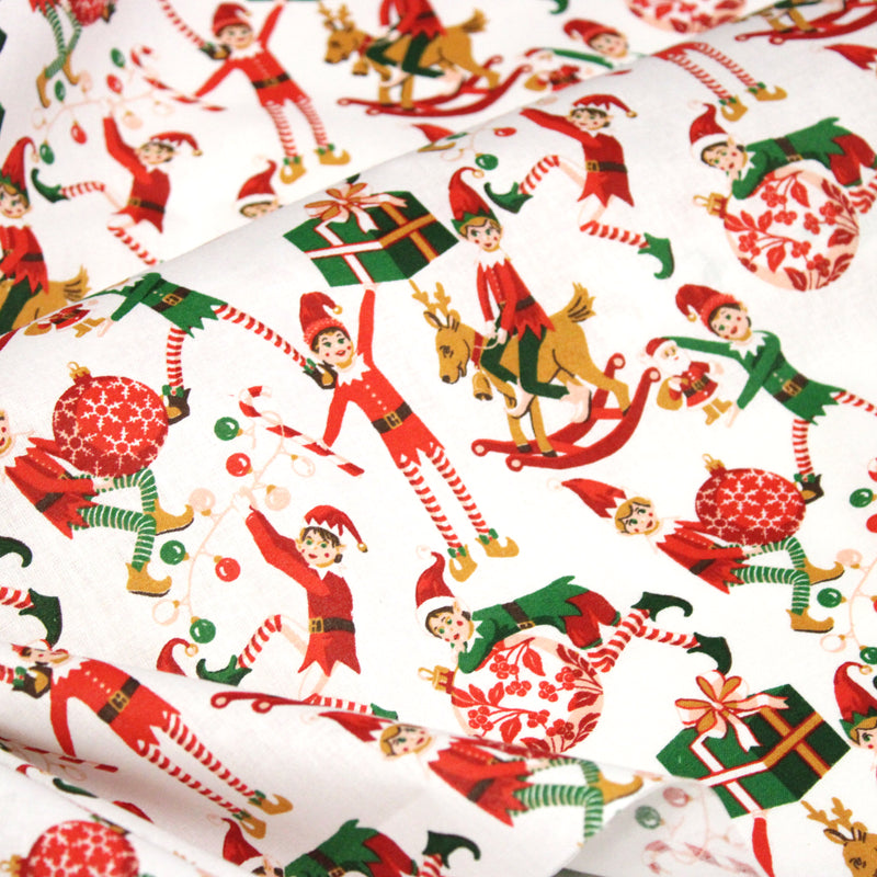 Tissu cotonnade de NOËL – La farandole des lutins, fond blanc - OEKO-TEX STANDARD 100