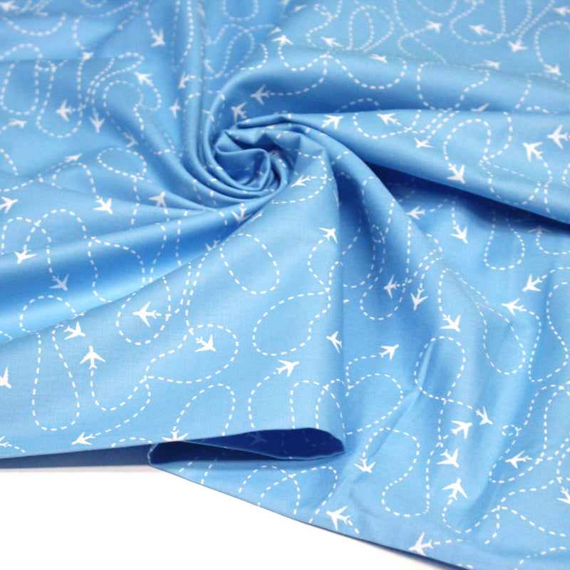 Tissu popeline coton bleu aux avions et lignes de vol, collection VOYAGE - TissusPapi.com