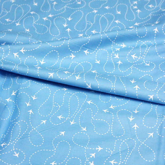 Tissu popeline coton bleu aux avions et lignes de vol, collection VOYAGE - TissusPapi.com