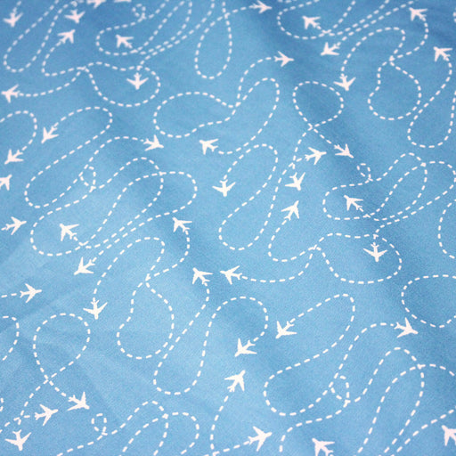Tissu popeline coton bleu aux avions et lignes de vol, collection VOYAGE - TissusPapi.com