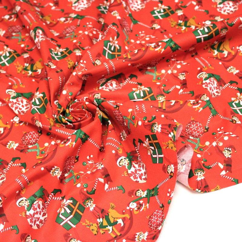 Tissu cotonnade de NOËL – La farandole des lutins, fond rouge - OEKO-TEX STANDARD 100 - TissusPapi.com