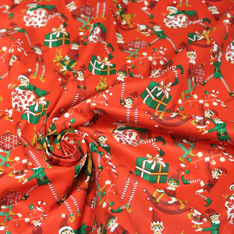 Tissu cotonnade de NOËL – La farandole des lutins, fond rouge - OEKO-TEX STANDARD 100 - TissusPapi.com
