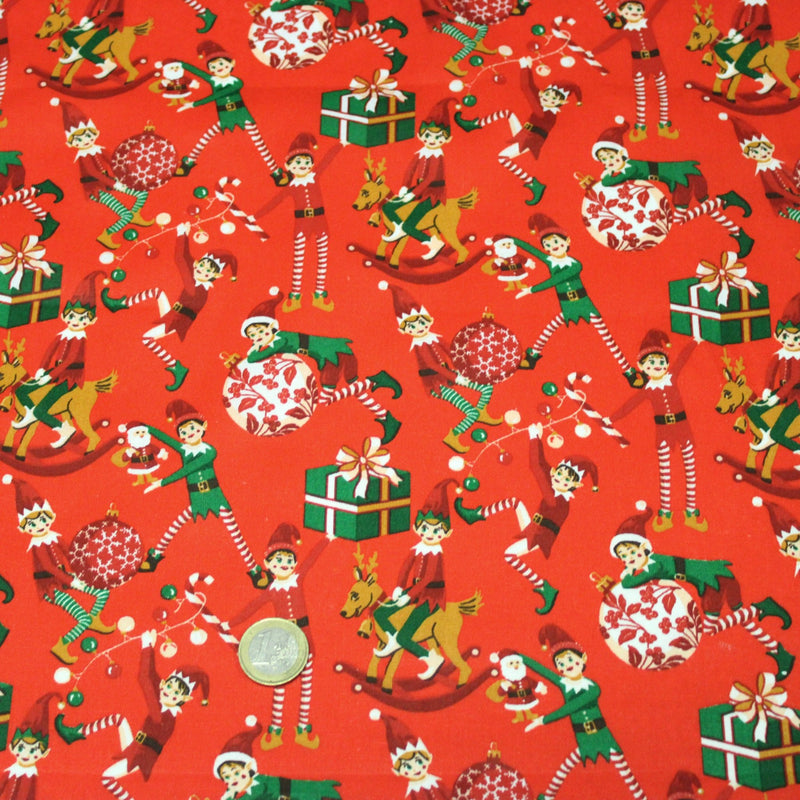 Tissu cotonnade de NOËL – La farandole des lutins, fond rouge - OEKO-TEX STANDARD 100 - TissusPapi.com