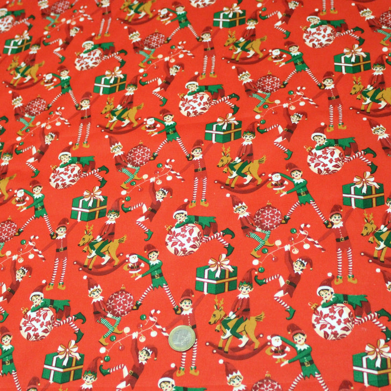 Tissu cotonnade de NOËL – La farandole des lutins, fond rouge - OEKO-TEX STANDARD 100 - TissusPapi.com