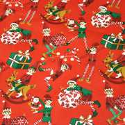 Tissu cotonnade de NOËL – La farandole des lutins, fond rouge - OEKO-TEX STANDARD 100 - TissusPapi.com
