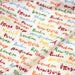 Tissu popeline coton blanc aux noms de ville multicolores, collection VOYAGE - TissusPapi.com