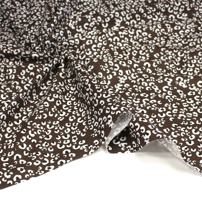 Tissu cotonnade LEOPARD, chocolat aux taches noires et blanches - OEKO-TEX