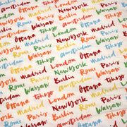 Tissu popeline coton blanc aux noms de ville multicolores, collection VOYAGE - TissusPapi.com