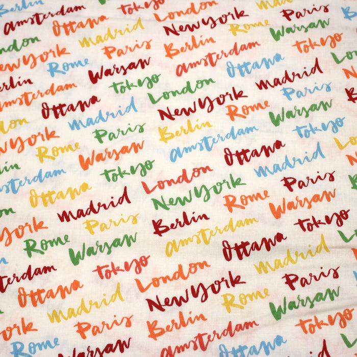 Tissu popeline coton blanc aux noms de ville multicolores, collection VOYAGE - TissusPapi.com
