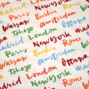 Tissu popeline coton blanc aux noms de ville multicolores, collection VOYAGE - TissusPapi.com