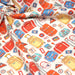 Tissu popeline coton Les valises et sacs à dos multicolores, collection VOYAGE - TissusPapi.com