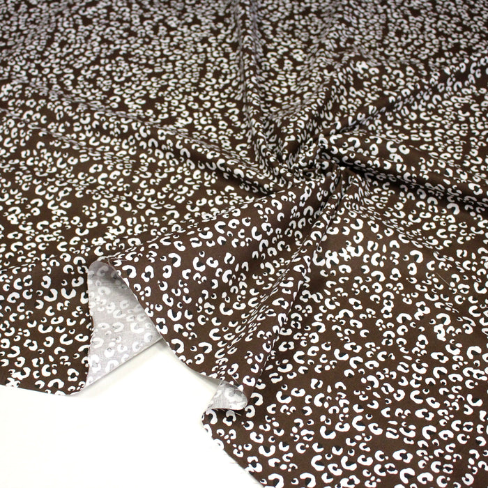 Tissu cotonnade LEOPARD, chocolat aux taches noires et blanches - OEKO-TEX