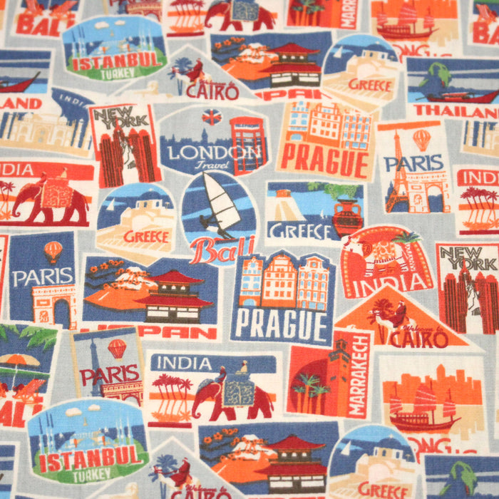 Tissu popeline coton, les autocollants de voyages, tons orange et bleus - TissusPapi.com