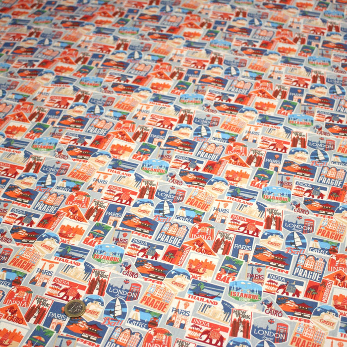 Tissu popeline coton, les autocollants de voyages, tons orange et bleus - TissusPapi.com