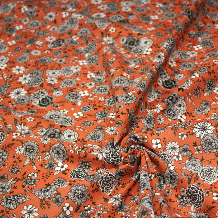 Tissu coton orange rouille & imprimé fleuri noir et blanc - COLLECTION SIRACUSA