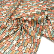 Tissu popeline coton, les valises & malettes, tons corail & vert amande - Collection VOYAGE - TissusPapi.com