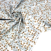Tissu popeline coton, bleu ciel aux fines fleurs ocre et tiges vertes - Collection britannique - TissusPapi.com