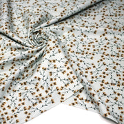 Tissu popeline coton, bleu ciel aux fines fleurs ocre et tiges vertes - Collection britannique - TissusPapi.com