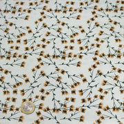 Tissu popeline coton, bleu ciel aux fines fleurs ocre et tiges vertes - Collection britannique - TissusPapi.com