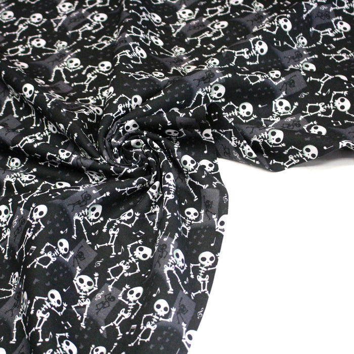 Tissu coton noir aux squelettes blancs - Collection Halloween - OEKO-TEX