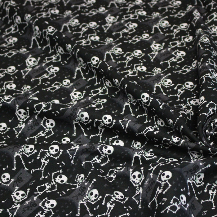 Tissu coton noir aux squelettes blancs - Collection Halloween - OEKO-TEX