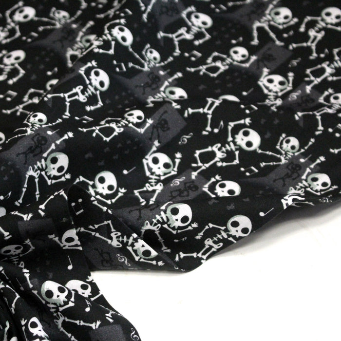 Tissu coton noir aux squelettes blancs - Collection Halloween - OEKO-TEX